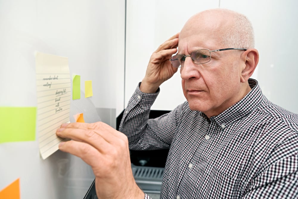  Elderly,Man,Looking,At,Notes.,Forgetful,Senior,With,Dementia,,Memory 